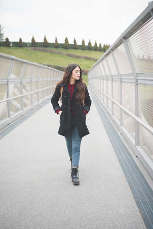 young beautiful long hair model woman living the city in winter outdoor cityの写真素材