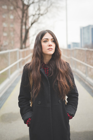 young beautiful long hair model woman living the city in winter outdoor cityの写真素材