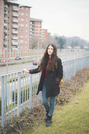 young beautiful long hair model woman living the city in winter outdoor cityの写真素材