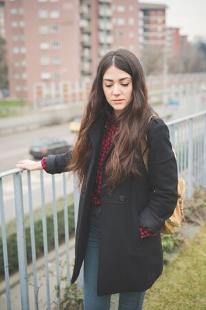 young beautiful long hair model woman living the city in winter outdoor cityの写真素材