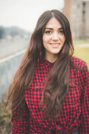 young beautiful long hair model woman living the city in winter outdoor cityの写真素材