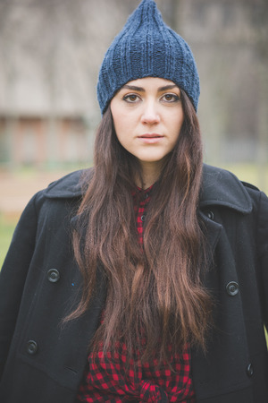young beautiful long hair model woman living the city in winter outdoor cityの写真素材