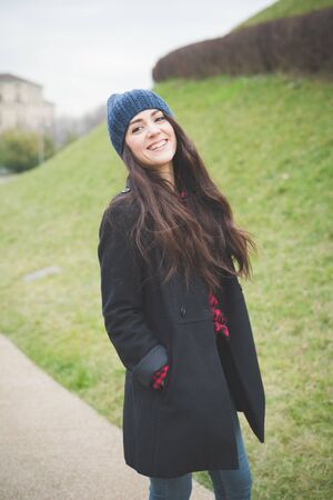 young beautiful long hair model woman living the city in winter outdoor cityの写真素材