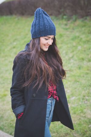 young beautiful long hair model woman living the city in winter outdoor cityの写真素材