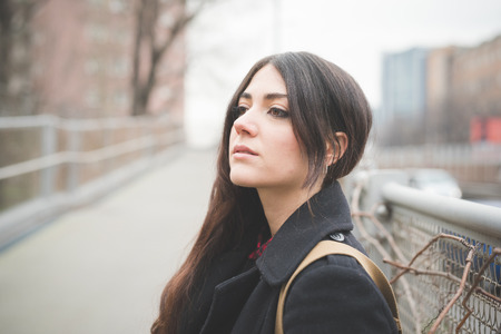young beautiful long hair model woman living the city in winter outdoor cityの写真素材