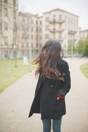young beautiful long hair model woman living the city in winter outdoor cityの写真素材