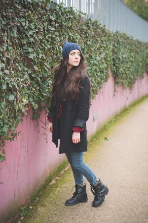young beautiful long hair model woman living the city in winter outdoor cityの写真素材