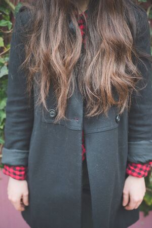 young beautiful long hair model woman living the city in winter outdoor cityの写真素材