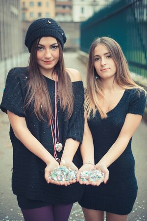 young couple beautiful women girls autumn outdoorの写真素材