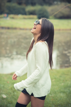 young beautiful brunette woman girl outdoorの写真素材