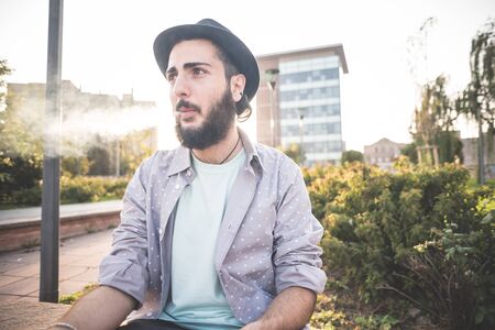 young handsome hipster gay modern man in townの写真素材