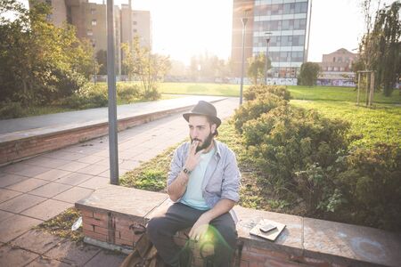 young handsome hipster gay modern man in townの写真素材