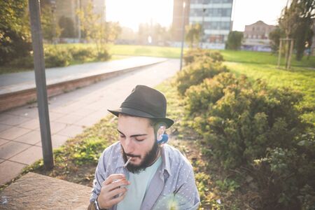 young handsome hipster gay modern man in townの写真素材