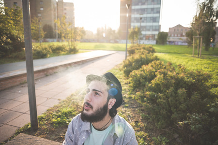 young handsome hipster gay modern man in townの写真素材