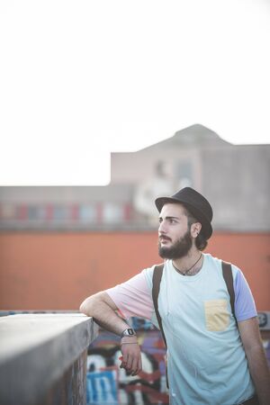 young handsome hipster gay modern man in townの写真素材