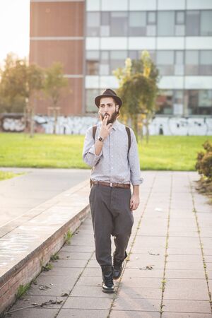 young handsome hipster gay modern man in townの写真素材