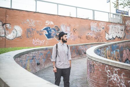 young handsome hipster gay modern man in townの写真素材