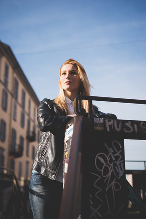 young beautiful blonde straight hair woman in the cityの写真素材