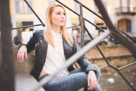 young beautiful blonde straight hair woman in the cityの写真素材