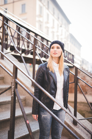 young beautiful blonde straight hair woman in the cityの写真素材