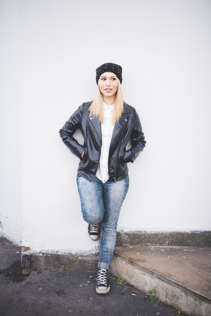 young beautiful blonde straight hair woman in the cityの写真素材