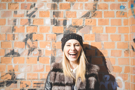 young beautiful blonde straight hair woman in the cityの写真素材