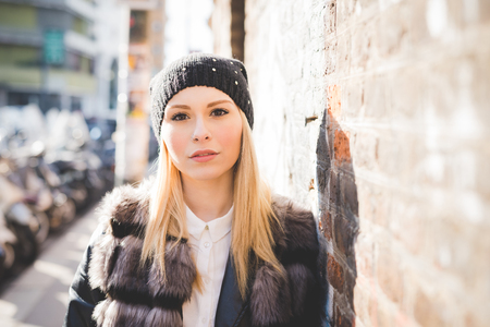 young beautiful blonde straight hair woman in the cityの写真素材