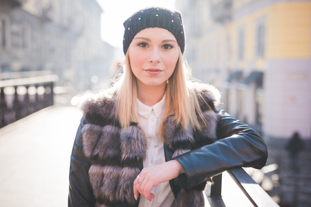 young beautiful blonde straight hair woman in the cityの写真素材