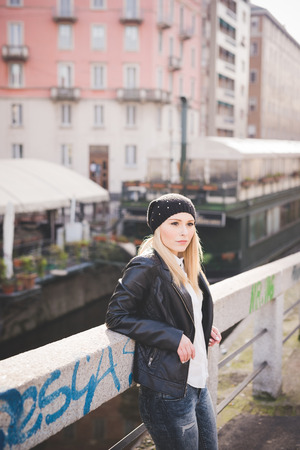 young beautiful blonde straight hair woman in the cityの写真素材
