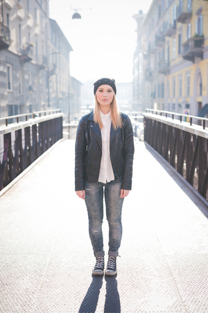 young beautiful blonde straight hair woman in the cityの写真素材