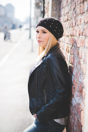 young beautiful blonde straight hair woman in the cityの写真素材