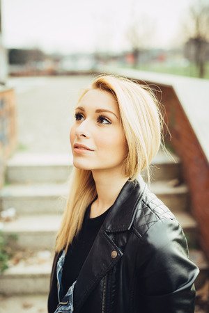 young beautiful blonde straight hair woman in the cityの写真素材