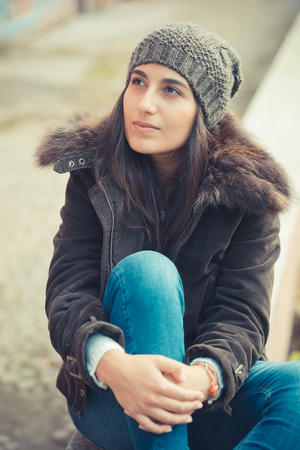 young beautiful brunette woman in the cityの写真素材