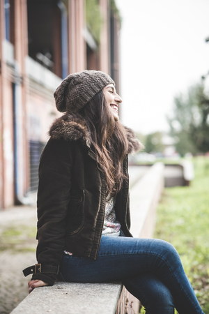 young beautiful brunette woman in the cityの写真素材