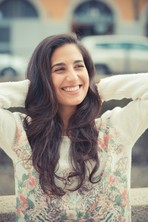 young beautiful brunette woman in the cityの写真素材