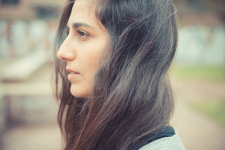 young beautiful brunette woman in the cityの写真素材