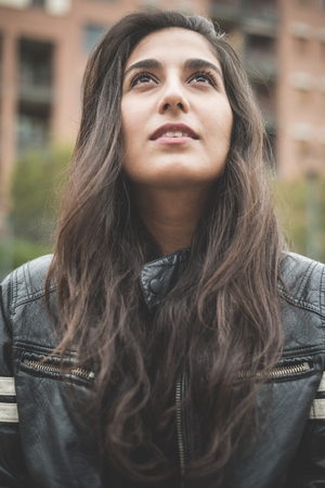 young beautiful brunette woman in the cityの写真素材