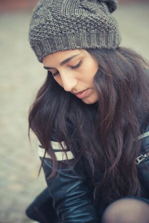 young beautiful brunette woman in the cityの写真素材