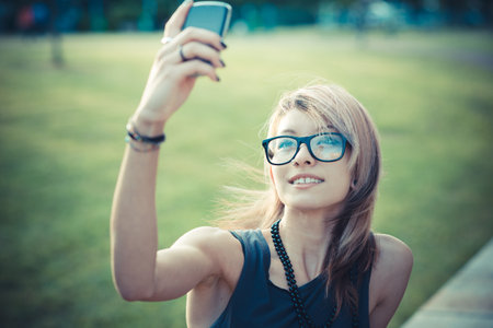 young beautiful model woman selfie in the cityの写真素材