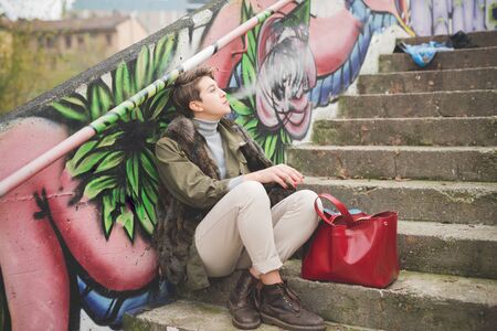 young beautiful short hair hipster woman in townの写真素材