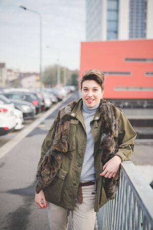 young beautiful short hair hipster woman in townの写真素材