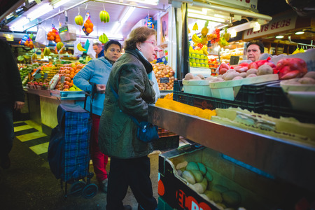 BARCELONA, SPAIN - MARCH 21: La rambla Boqueria marketplace on March 21, 2015. Boqueria is the most famous marketplace in Barcelona, in front of la rambla street.のeditorial素材