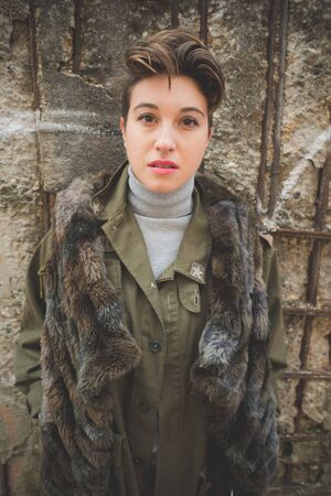 young beautiful short hair hipster woman in townの写真素材