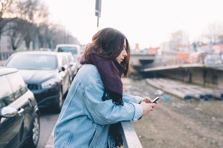 young beautiful woman using smartphone in the cityの写真素材