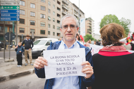 MILAN, ITALY - MAY 05: Students manifestation held in Milan on May, 5 2015. Students and teachers took to the streets to protest against new laws on education by minister Stefania Gianniniのeditorial素材