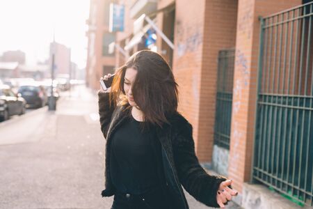 young beautiful woman in the cityの写真素材