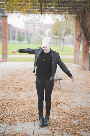 rabbit mask woman at the park outdoorの写真素材