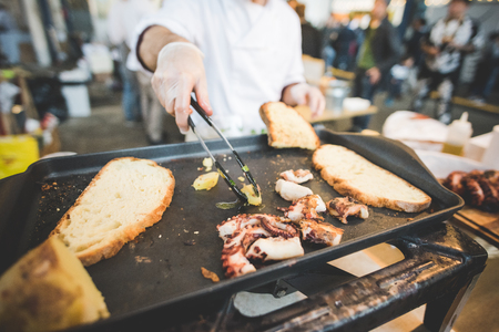 MILAN, ITALY - NOVEMBER 7: People visiting Eat Market, a street food parade with international dishes  in Milan on November, 21 2015.のeditorial素材