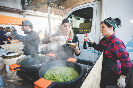 MILAN, ITALY - NOVEMBER 7: People visiting Eat Market, a street food parade with international dishes  in Milan on November, 21 2015.のeditorial素材