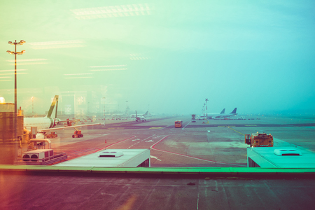 Landing field of the airport view from the window, filtered vintage - traveling, business trip, journey conceptの写真素材